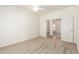 The spacious bedroom offers neutral carpet, double doors, and natural light at 5234 E Carol Ave, Mesa, AZ 85206