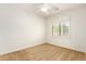 Bright bedroom with neutral carpet, ceiling fan, and window with shutters provides ample natural light at 5234 E Carol Ave, Mesa, AZ 85206