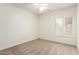 A standard bedroom has plush carpet and shuttered windows to let in natural light at 5234 E Carol Ave, Mesa, AZ 85206