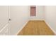 This functional bedroom features neutral carpet, a window, and a standard door at 5234 E Carol Ave, Mesa, AZ 85206