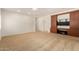 Bedroom featuring carpet flooring and a built-in entertainment center at 5234 E Carol Ave, Mesa, AZ 85206