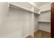 A spacious walk-in closet offers ample hanging space for clothes and accessories at 5234 E Carol Ave, Mesa, AZ 85206