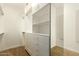 A customized walk-in closet offers plentiful storage with shelves, drawers, and a mirror at 5234 E Carol Ave, Mesa, AZ 85206