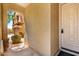 Home entryway featuring stucco walls, covered archway, and a light colored front door at 5234 E Carol Ave, Mesa, AZ 85206