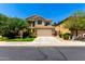 Charming two-story home featuring desert landscaping, tile roof, and an attached two-car garage at 5234 E Carol Ave, Mesa, AZ 85206