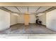 Spacious garage with epoxy floors, overhead storage, and built-in cabinets for organized storage at 5234 E Carol Ave, Mesa, AZ 85206