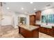 Well-lit kitchen features an island and stainless steel appliances at 5234 E Carol Ave, Mesa, AZ 85206