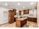 Gourmet kitchen with granite countertops, custom cabinets, travertine floors, and stainless steel appliances at 5234 E Carol Ave, Mesa, AZ 85206