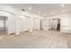 Spacious living room with neutral carpet, arched doorways, and recessed lighting at 5234 E Carol Ave, Mesa, AZ 85206