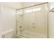 Clean bathroom features a shower-tub combination with glass doors and chrome hardware at 5234 E Carol Ave, Mesa, AZ 85206
