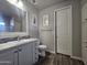 Bathroom featuring a modern vanity, toilet, and closet, all complemented by stylish flooring at 650 N Hawes Rd # 3312, Mesa, AZ 85207