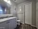 Bathroom featuring a modern vanity, toilet, and closet, all complemented by stylish flooring at 650 N Hawes Rd # 3312, Mesa, AZ 85207