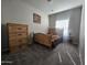 Cozy bedroom featuring a comfy bed, dresser, and nightstand at 650 N Hawes Rd # 3312, Mesa, AZ 85207