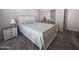 A comfortable bedroom featuring a light-colored bed with a matching nightstand and mirrored closet at 650 N Hawes Rd # 3312, Mesa, AZ 85207