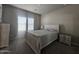 Bright bedroom featuring a light wood bed frame, dresser, and a window with natural light at 650 N Hawes Rd # 3312, Mesa, AZ 85207
