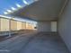 Home carport and adjacent yard at 650 N Hawes Rd # 3312, Mesa, AZ 85207