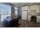 Eat-in kitchen features a white refrigerator, built in desk and white cabinets at 650 N Hawes Rd # 3312, Mesa, AZ 85207