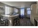 Bright eat-in kitchen features a breakfast bar, white cabinets, and modern appliances at 650 N Hawes Rd # 3312, Mesa, AZ 85207
