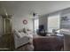 Comfortable living room with stylish decor, ceiling fan and natural light at 650 N Hawes Rd # 3312, Mesa, AZ 85207