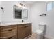 Modern bathroom features a floating vanity, decorative mirror and ceramic tile at 715 S Saranac Ave, Mesa, AZ 85208