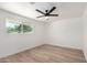 Light-filled bedroom with wood floors and scenic views at 715 S Saranac Ave, Mesa, AZ 85208