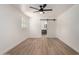 Bright bedroom with wood floors, barn door and ceiling fan at 715 S Saranac Ave, Mesa, AZ 85208