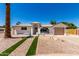 Charming single-story home featuring desert landscaping and a welcoming brick pathway to the front door at 715 S Saranac Ave, Mesa, AZ 85208