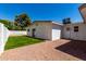 Back exterior featuring gravel area and small turf area under a clear blue sky at 715 S Saranac Ave, Mesa, AZ 85208