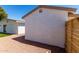 Back of home featuring low maintenance desert landscaping, and neutral colored stucco at 715 S Saranac Ave, Mesa, AZ 85208