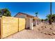 Charming single-story home with a new fence, stucco exterior, rock landscaping, and a covered patio at 715 S Saranac Ave, Mesa, AZ 85208