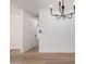 Bright living room showing modern lighting fixtures and an open floor plan at 715 S Saranac Ave, Mesa, AZ 85208