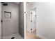 Contemporary shower features a modern faucet and gray ceramic tile at 715 S Saranac Ave, Mesa, AZ 85208