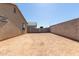 Backyard with a secure block fence, providing a safe and secluded area for outdoor enjoyment and recreation at 7224 W Puget Ave, Peoria, AZ 85345