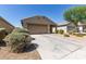 Charming single-story home featuring a neutral color palette, desert landscaping, and an attached two-car garage at 7224 W Puget Ave, Peoria, AZ 85345
