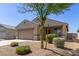 Charming single-story home featuring a neutral color palette, desert landscaping, and an attached two-car garage at 7224 W Puget Ave, Peoria, AZ 85345
