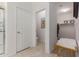 Bright hallway leads to bathroom and walk-in closet with ample storage in this home at 7224 W Puget Ave, Peoria, AZ 85345