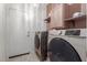 Modern laundry room with a new washer and dryer at 7224 W Puget Ave, Peoria, AZ 85345