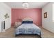 Comfortable bedroom featuring a chandelier, plush carpet, and a relaxing atmosphere, perfect for unwinding at 7224 W Puget Ave, Peoria, AZ 85345