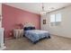 Cozy bedroom features a chandelier, plush carpeting, and neutral color scheme to make the perfect relaxation space at 7224 W Puget Ave, Peoria, AZ 85345
