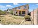 Large backyard with grass, partial covered patio, and mature landscaping at 7243 W Sandra Ter, Peoria, AZ 85382