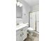 Clean bathroom featuring white vanity, modern mirror, and glass-enclosed shower at 7243 W Sandra Ter, Peoria, AZ 85382