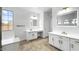 Bright bathroom featuring double sinks, quartz countertops, and elegant mirrors at 7243 W Sandra Ter, Peoria, AZ 85382