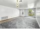 Bright living room with large windows, gray carpet and tile flooring at 7243 W Sandra Ter, Peoria, AZ 85382