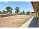 Spacious backyard with a block wall and landscaping potential, offering ample room for outdoor activities at 7430 E Ed Rice Ave, Mesa, AZ 85208