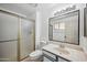 Bathroom featuring a shower, toilet, vanity, and a large mirror at 7430 E Ed Rice Ave, Mesa, AZ 85208