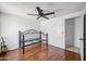 Bedroom featuring laminate flooring, a ceiling fan, and ample space at 7430 E Ed Rice Ave, Mesa, AZ 85208