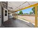 Covered patio featuring a ceiling fan and an open view to the spacious backyard, great for outdoor entertaining at 7430 E Ed Rice Ave, Mesa, AZ 85208