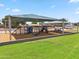 Community playground featuring play structures and green space, providing a safe and fun area for children at 7430 E Ed Rice Ave, Mesa, AZ 85208