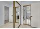 Bright bathroom with tile floors, large mirror, and sliding door access to an adjoining room at 7431 W Mclellan Rd, Glendale, AZ 85303