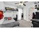 Inviting bedroom with gray carpet, a ceiling fan, shelving, and decor at 7431 W Mclellan Rd, Glendale, AZ 85303